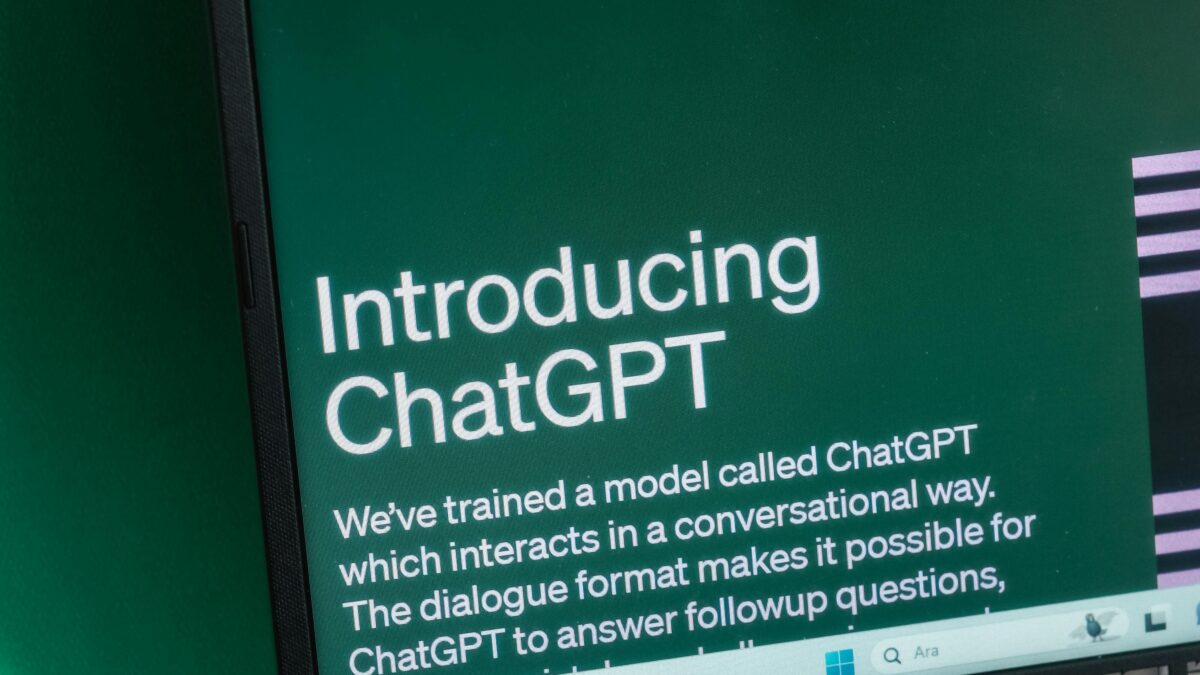 Laptop screen displaying the introductory page of ChatGPT on OpenAI's website.