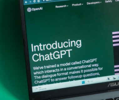 Laptop screen displaying the introductory page of ChatGPT on OpenAI's website.